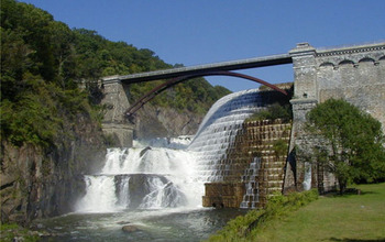waterfall under a bridge